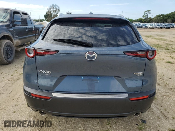 2024 Mazda CX-30 Premium z VIN 3MVDMBDY5RM616352, wystawiony jako Copart lot #68625774 z przebiegiem Nie podano mil oraz Szkody całkowita. Historia ofert i sprzedaży dostępna na DreamBid. Obrazek 6.