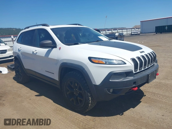 2014 Jeep Cherokee Trailhawk with VIN 1C4PJMBSXEW236807, listed as a IAAI auction lot 42660980 with 157,225 mi miles and . Bid and sale history available at DreamBid. Image 1.