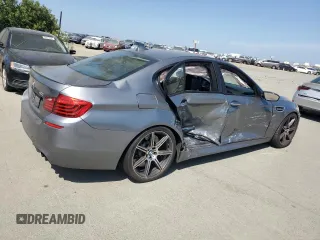 2014 BMW M5 z VIN WBSFV9C58ED593431, wystawiony jako Copart lot #54870555 z przebiegiem 172 191 mil mil oraz Szkoda całkowita • Salvage title. Historia ofert i sprzedaży dostępna na DreamBid. Obrazek 3.