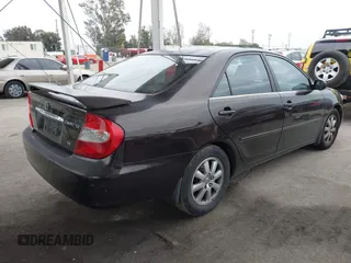2002 Toyota Camry XLE z VIN JTDBF32K520006497, wystawiony jako IAAI lot #42021538 z przebiegiem 162 583 mil mil oraz . Historia ofert i sprzedaży dostępna na DreamBid. Obrazek 4.