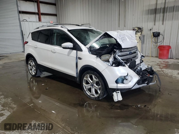 2019 Ford Escape Titanium z VIN 1FMCU9J97KUA85865, wystawiony jako Copart lot #56643135 z przebiegiem Nie podano mil oraz Szkoda całkowita • Salvage title. Historia ofert i sprzedaży dostępna na DreamBid. Obrazek 4.