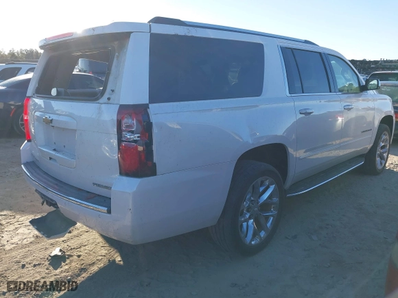 2019 Chevrolet Suburban Premier with VIN 1GNSCJKC0KR293658, listed as a IAAI auction lot 40563834 with 153,619 mi miles. Bid and sale history available at carsss.com. Image 4.