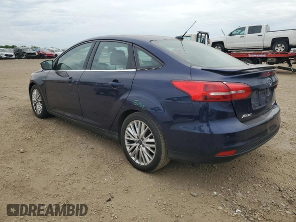 2017 Ford Focus Titanium with VIN 1FADP3J27HL298402, listed as a Copart auction lot 57340875 with 110,172 mi miles and Salvage title. Bid and sale history available at DreamBid. Image 2.