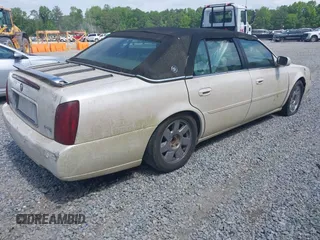 2000 Cadillac DeVille DTS z VIN 1G6KF5792YU216318, wystawiony jako IAAI lot #42134531 z przebiegiem 167 518 mil mil oraz . Historia ofert i sprzedaży dostępna na DreamBid. Obrazek 4.