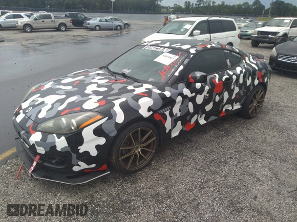2008 Hyundai Tiburon GT z VIN KMHHN66F58U262230, wystawiony jako IAAI lot #33619963 z przebiegiem 150 708 mil mil oraz . Historia ofert i sprzedaży dostępna na DreamBid. Obrazek 2.