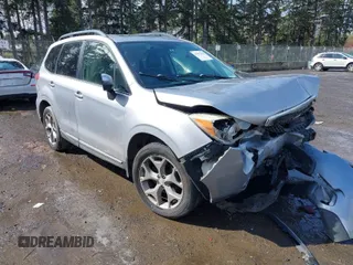 2015 Subaru Forester Touring with VIN JF2SJAWC7FH426132, listed as a IAAI auction lot 41937213 with 125,137 mi miles and . Bid and sale history available at DreamBid. Image 1.