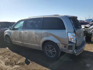 2016 Dodge Grand Caravan SXT with VIN 2C4RDGCG5GR219517, listed as a Copart auction lot 50052405 with 104,552 mi miles and Salvage Title. Bid and sale history available at DreamBid. Image 2.