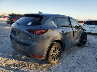 2021 Mazda CX-5 Touring with VIN JM3KFACM3M0387734, listed as a Copart auction lot 79894294 with 65,819 mi miles and Clean Title. Bid and sale history available at carsss.com. Image 3.