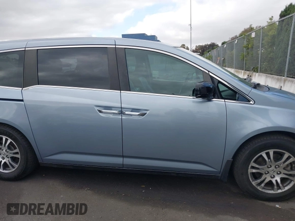 2012 Honda Odyssey EX-L with VIN 5FNRL5H60CB095086, listed as a IAAI auction lot 42251330 with 144,232 mi miles and . Bid and sale history available at DreamBid. Image 13.