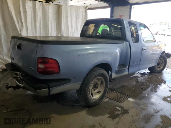 1997 Ford F-150 with VIN 1FTDX076XVKC72073, listed as a Copart auction lot 62774955 with 204,105 mi miles and Salvage title. Bid and sale history available at DreamBid. Image 3.