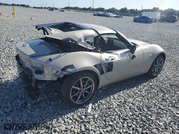2023 Mazda MX-5 Miata Grand Touring z VIN JM1NDAM70P0551336, wystawiony jako Copart lot #54984385 z przebiegiem 10 948 mil mil oraz Szkoda całkowita • Salvage title. Historia ofert i sprzedaży dostępna na DreamBid. Obrazek 3.