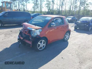 2013 Scion iQ z VIN JTNJJXB0XDJ024874, wystawiony jako IAAI lot #41832058 z przebiegiem Nie podano mil oraz . Historia ofert i sprzedaży dostępna na DreamBid. Obrazek 2.