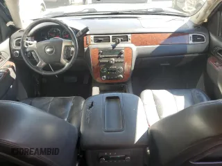 2014 Chevrolet Suburban LT with VIN 1GNSKJE71ER227075, listed as a Copart auction lot 76675654 with 214,113 mi miles and Salvage Title. Bid and sale history available at DreamBid. Image 8.