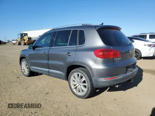 2014 Volkswagen Tiguan SEL with VIN WVGAV3AX0EW555873, listed as a Copart auction lot 55695955 with 69,984 mi miles and Salvage title. Bid and sale history available at DreamBid. Image 2.