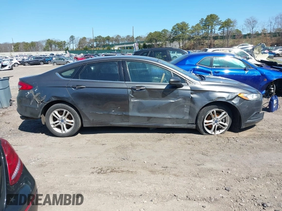 2018 Ford Fusion SE z VIN 3FA6P0H74JR233829, wystawiony jako IAAI lot #42049766 z przebiegiem 120 370 mil mil oraz . Historia ofert i sprzedaży dostępna na DreamBid. Obrazek 13.
