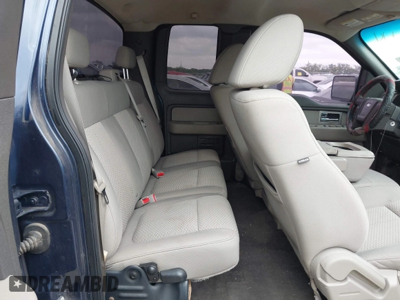 2009 Ford F-150 STX with VIN 1FTRX12889FA97356, listed as a IAAI auction lot 42121444 with 166,010 mi miles and . Bid and sale history available at DreamBid. Image 8.