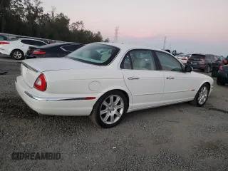 2004 Jaguar XJ with VIN SAJWA71C14SG16264, listed as a Copart auction lot 83251554 with 267,493 mi miles and Salvage Title. Bid and sale history available at carsss.com. Image 3.