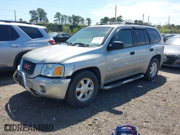 2004 GMC Envoy SLE with VIN 1GKDT13S042113411, listed as a IAAI auction lot 42117824 with 116,827 mi miles. Bid and sale history available at carsss.com. Image 2.