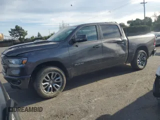 2023 Ram 1500 Laramie with VIN 1C6SRFJT0PN658710, listed as a Copart auction lot 50187075 with 14,664 mi miles and Salvage title. Bid and sale history available at DreamBid. Image 1.