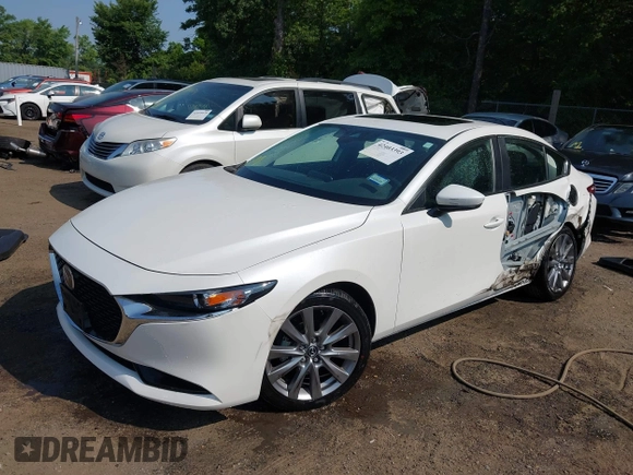 2022 Mazda 3 Carbon Edition with VIN 3MZBPACL0NM318573, listed as a IAAI auction lot 42403393 with 8,762 mi miles and . Bid and sale history available at DreamBid. Image 2.