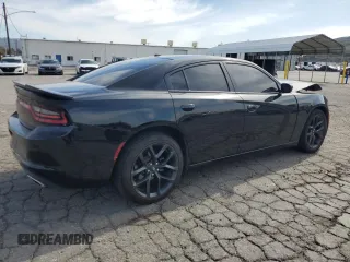 2021 Dodge Charger SXT with VIN 2C3CDXBG9MH682354, listed as a Copart auction lot 48586415 with 112,449 mi miles and Salvage Title. Bid and sale history available at carsss.com. Image 3.