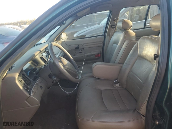 2000 Ford Crown Victoria LX with VIN 2FAFP74W9YX146624, listed as a Copart auction lot 77495074 with 167,594 mi miles and Salvage Title. Bid and sale history available at carsss.com. Image 7.