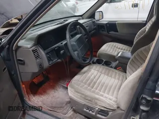 1995 Jeep Grand Cherokee Laredo with VIN 1J4GZ58S6SC765863, listed as a IAAI auction lot 41797726 with 234,715 mi miles and . Bid and sale history available at DreamBid. Image 14.