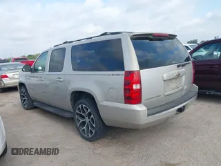 2009 Chevrolet Suburban LT w/2LT with VIN 1GNFC26039R234735, listed as a IAAI auction lot 42068617 with 263,534 mi miles. Bid and sale history available at carsss.com. Image 3.