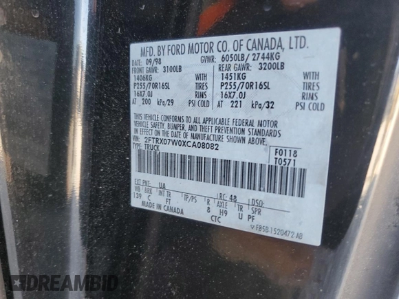 1999 Ford F-150 XL with VIN 2FTRX07W0XCA08082, listed as a Copart auction lot 82246214 with 189,950 mi miles and Salvage title. Bid and sale history available at DreamBid. Image 12.