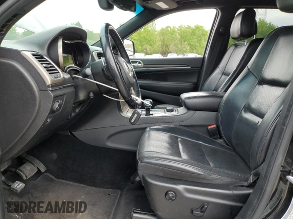 2014 Jeep Grand Cherokee Limited with VIN 1C4RJFBG0EC517032, listed as a Copart auction lot 58813355 with 173,616 mi miles and Salvage title. Bid and sale history available at DreamBid. Image 7.