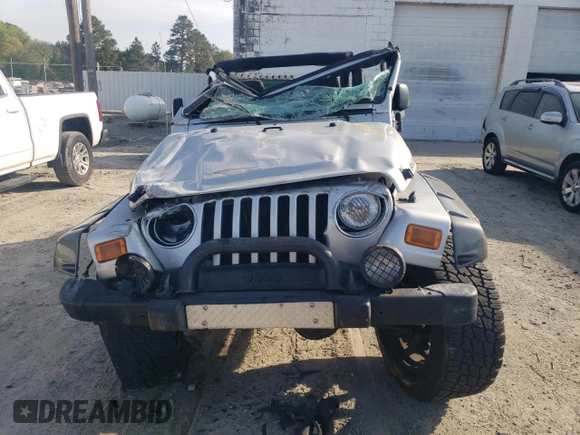 2003 Jeep Wrangler Rubicon z VIN 1J4FA69S53P375189, wystawiony jako Copart lot #54292035 z przebiegiem 55 863 mil mil oraz Szkoda całkowita • Salvage title. Historia ofert i sprzedaży dostępna na DreamBid. Obrazek 5.