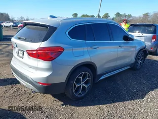 2018 BMW X1 xDrive28i with VIN WBXHT3C30J5L29757, listed as a IAAI auction lot 41879504 with 60,490 mi miles. Bid and sale history available at carsss.com. Image 4.