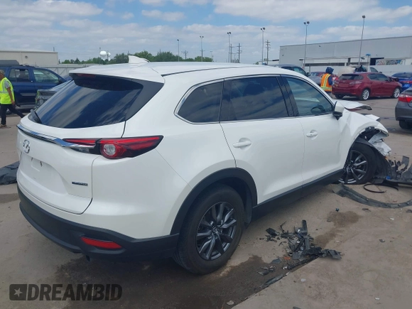 2022 Mazda CX-9 Touring with VIN JM3TCBCY0N0608052, listed as a IAAI auction lot 42027465 with 65,313 mi miles and . Bid and sale history available at DreamBid. Image 4.