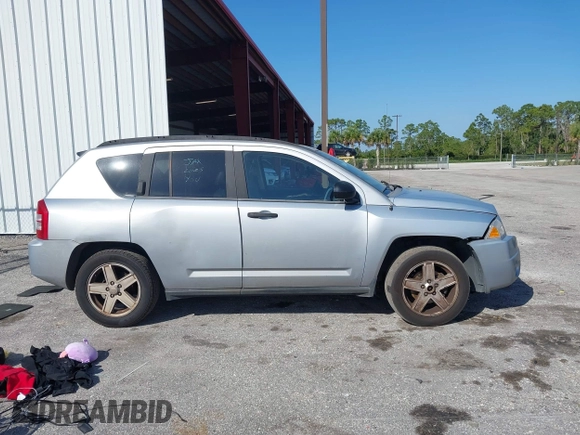 2007 Jeep Compass Sport with VIN 1J8FT47W57D185807, listed as a IAAI auction lot 41700283 with 194,339 mi miles. Bid and sale history available at carsss.com. Image 13.