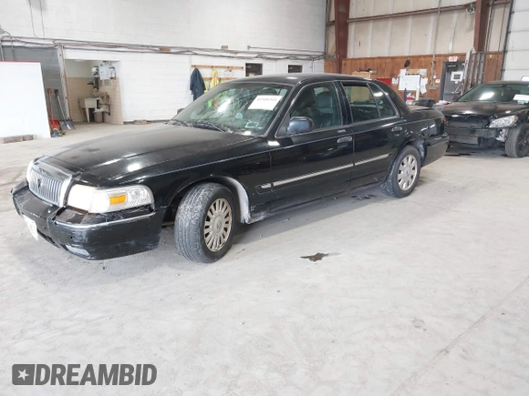 2008 Mercury Grand Marquis LS z VIN 2MEFM75V18X617284, wystawiony jako IAAI lot #41948364 z przebiegiem 106 294 mil mil oraz . Historia ofert i sprzedaży dostępna na DreamBid. Obrazek 2.