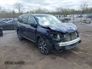 2019 Honda Pilot Touring 7-Passenger z VIN 5FNYF6H68KB001978, wystawiony jako IAAI lot #42091795 z przebiegiem 129 145 mil mil oraz . Historia ofert i sprzedaży dostępna na DreamBid. Obrazek 1.