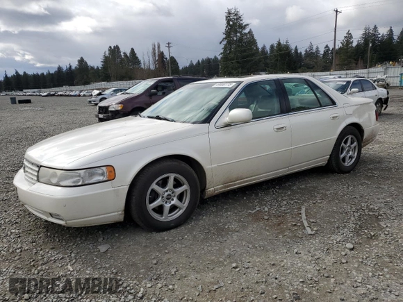 2000 Cadillac Seville Touring STS z VIN 1G6KY5497YU191639, wystawiony jako Copart lot #49658115 z przebiegiem 82 725 mil mil oraz Szkoda całkowita • Salvage title. Historia ofert i sprzedaży dostępna na DreamBid. Obrazek 1.