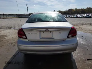 2003 Ford Taurus LX Standard z VIN 1FAFP52U93A159333, wystawiony jako Copart lot #78080944 z przebiegiem 54 652 mil mil oraz Szkoda całkowita • Salvage title. Historia ofert i sprzedaży dostępna na DreamBid. Obrazek 6.