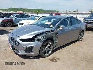 2020 Ford Fusion SEL with VIN 3FA6P0CDXLR196124, listed as a IAAI auction lot 42244231 with 99,306 mi miles and . Bid and sale history available at DreamBid. Image 2.