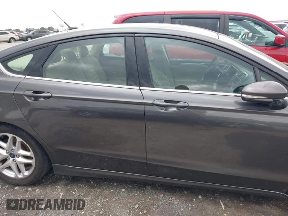 2015 Ford Fusion SE z VIN 1FA6P0H73F5121260, wystawiony jako IAAI lot #41837294 z przebiegiem 169 246 mil mil oraz . Historia ofert i sprzedaży dostępna na DreamBid. Obrazek 13.