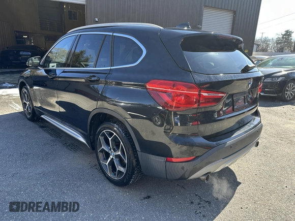 2017 BMW X1 xDrive28i with VIN WBXHT3C32H5F67896, listed as a IAAI auction lot 41823288 with 80,130 mi miles. Bid and sale history available at carsss.com. Image 3.