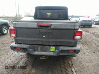 2021 Jeep Gladiator Sport S z VIN 1C6HJTAG3ML597041, wystawiony jako IAAI lot #41714640 z przebiegiem 46 402 mil mil oraz . Historia ofert i sprzedaży dostępna na DreamBid. Obrazek 16.