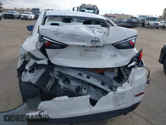 2016 Scion iA z VIN 3MYDLBZV9GY139080, wystawiony jako IAAI lot #41494384 z przebiegiem 106 092 mil mil oraz . Historia ofert i sprzedaży dostępna na DreamBid. Obrazek 16.