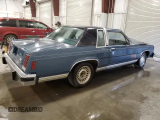 1987 Ford Crown Victoria z VIN 2FABP71F2HX156902, wystawiony jako Copart lot #74368944 z przebiegiem 77 708 mil mil oraz Szkoda całkowita • Salvage title. Historia ofert i sprzedaży dostępna na DreamBid. Obrazek 3.