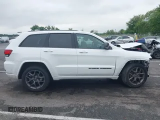 2021 Jeep Grand Cherokee 80th Anniversary with VIN 1C4RJFBG2MC568028, listed as a IAAI auction lot 42381104 with 51,027 mi miles and . Bid and sale history available at DreamBid. Image 13.