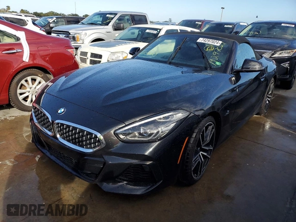 2020 BMW Z4 sDrive30i with VIN WBAHF3C06LWW75400, listed as a Copart auction lot 74297024 with 34,559 mi miles and Salvage Title. Bid and sale history available at carsss.com. Image 1.