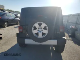 2010 Jeep Wrangler Sahara z VIN 1J4AA5D1XAL227305, wystawiony jako Copart lot #70165554 z przebiegiem Nie podano mil oraz Szkoda całkowita • Salvage title. Historia ofert i sprzedaży dostępna na DreamBid. Obrazek 6.
