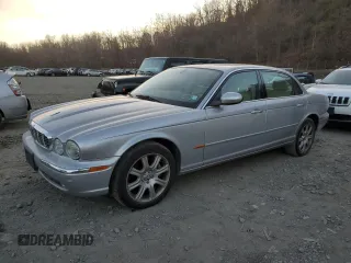 2005 Jaguar XJ with VIN SAJWA79C55SG37981, listed as a Copart auction lot 81142484 with 128,601 mi miles and Salvage Title. Bid and sale history available at carsss.com. Image 1.