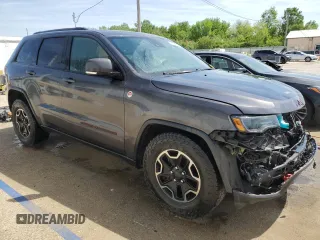 2017 Jeep Grand Cherokee Trailhawk with VIN 1C4RJFLGXHC654112, listed as a Copart auction lot 56397195 with 168,136 mi miles and Salvage title. Bid and sale history available at DreamBid. Image 4.