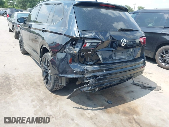 2021 Volkswagen Tiguan SE z VIN 3VV3B7AX0MM047478, wystawiony jako IAAI lot #42144239 z przebiegiem 55 468 mil mil oraz . Historia ofert i sprzedaży dostępna na DreamBid. Obrazek 6.